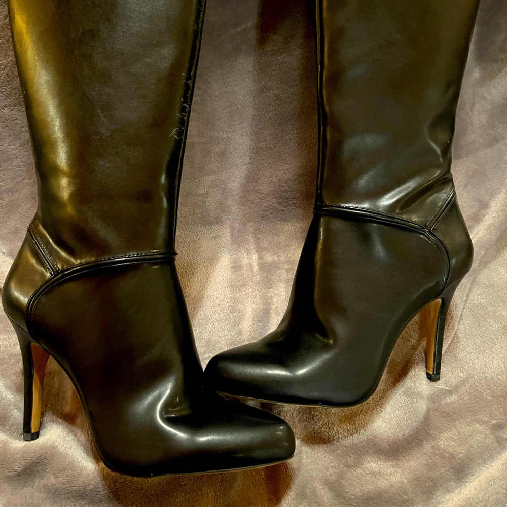 New knee high boots Great if you have larger muscular calves!!! 4 inch heel
